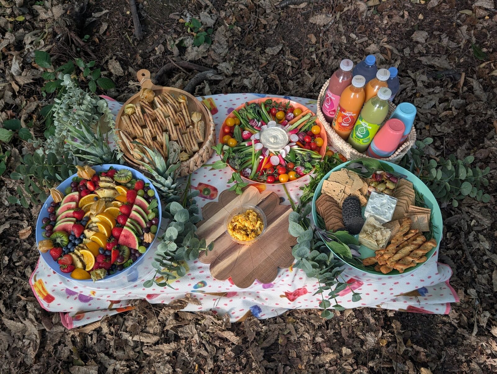 An abundant grazing board with cheeses, charcuterie, figs, honeycomb and rosemary